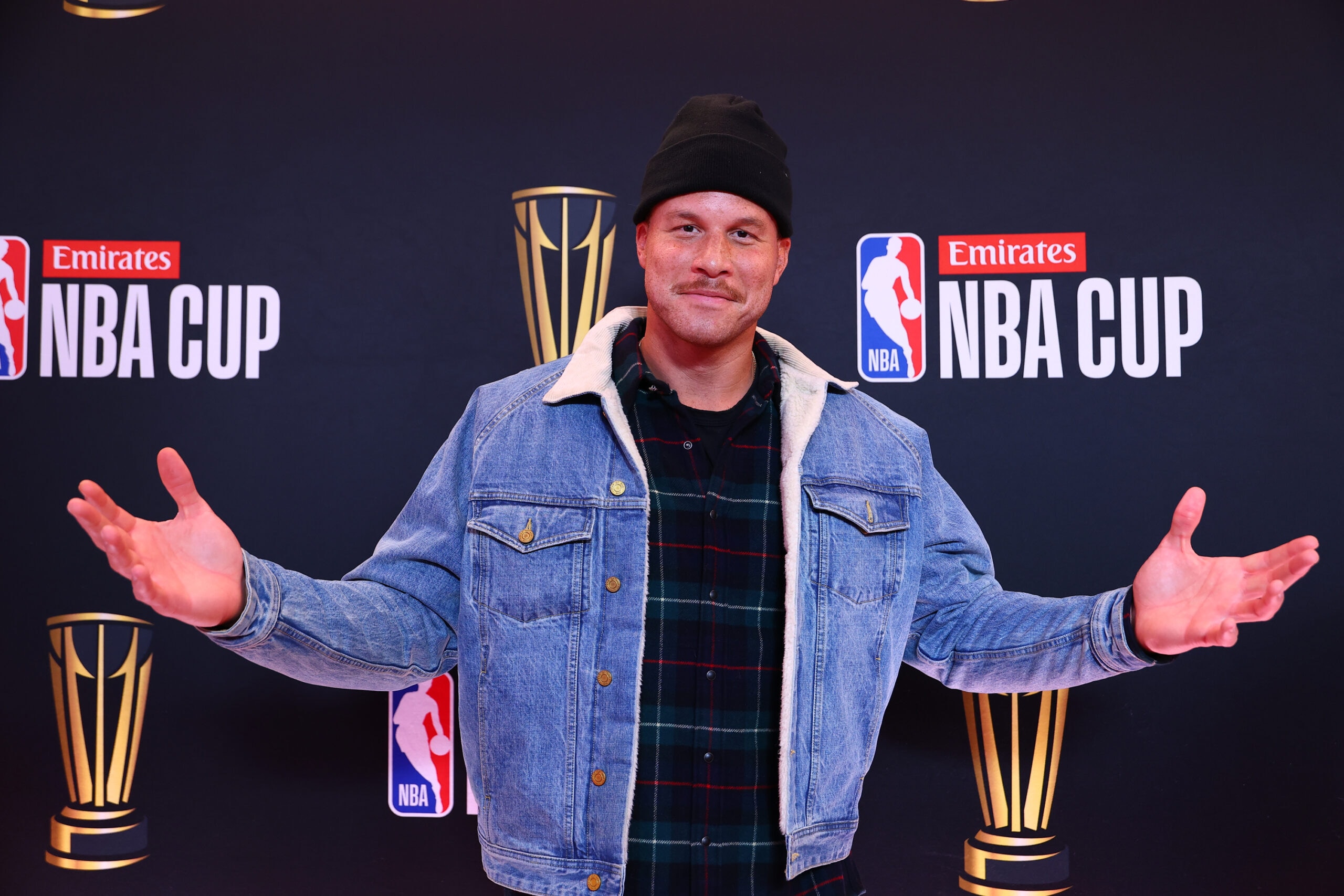Carmelo Anthony at NBC Sports studio with basketball backdrop