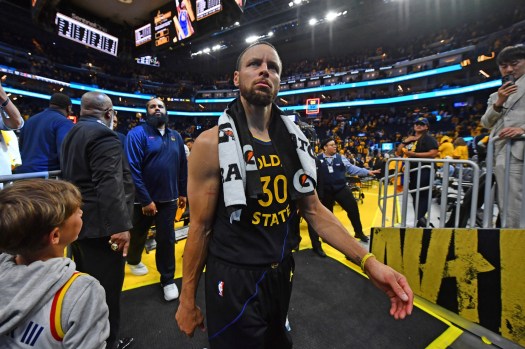 Steph Curry walks off the court after a tough playoff loss