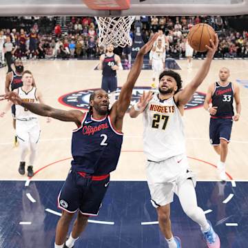 derrick jones jr. leaping for a dunk in an NBA game