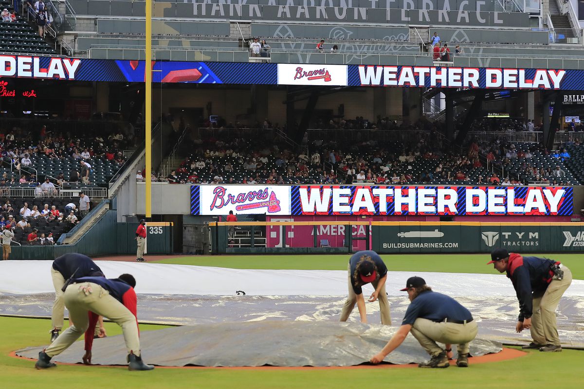 Braves fans waiting at Truist Park for a rain-delayed game