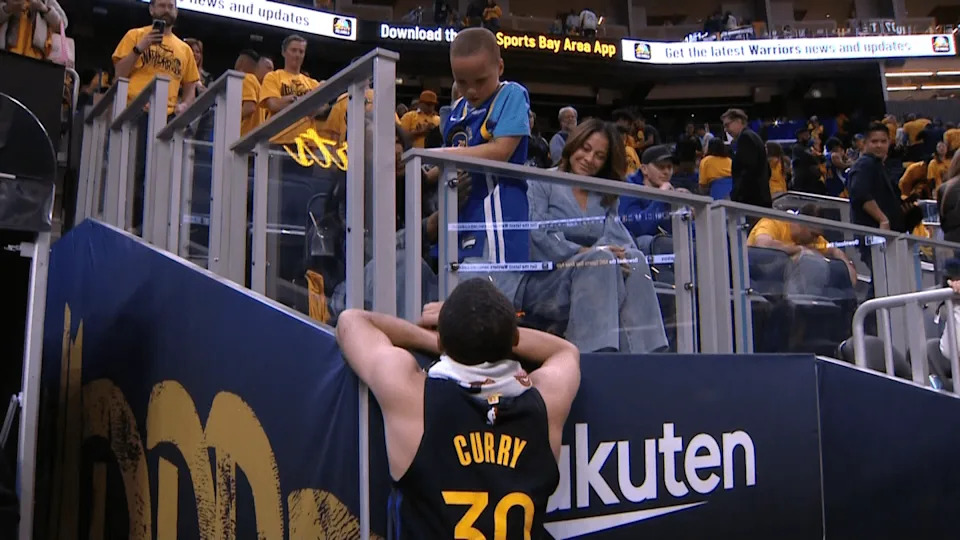 Stephen Curry in action during the playoffs, showing resilience on the court.