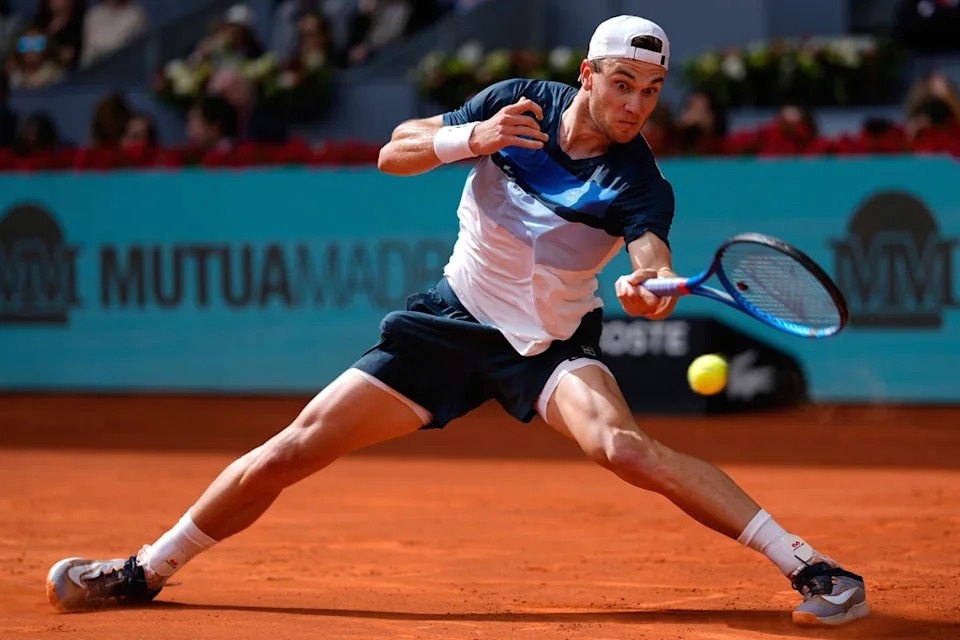 Casper Ruud in action during the Madrid Open, focusing on his forehand technique