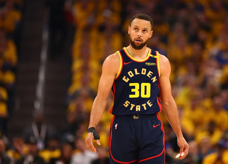 Steph Curry celebrates after a game, representing impactful Steph Curry stats in the playoffs