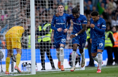 Chelsea and Liverpool players vie for possession in a Premier League match
