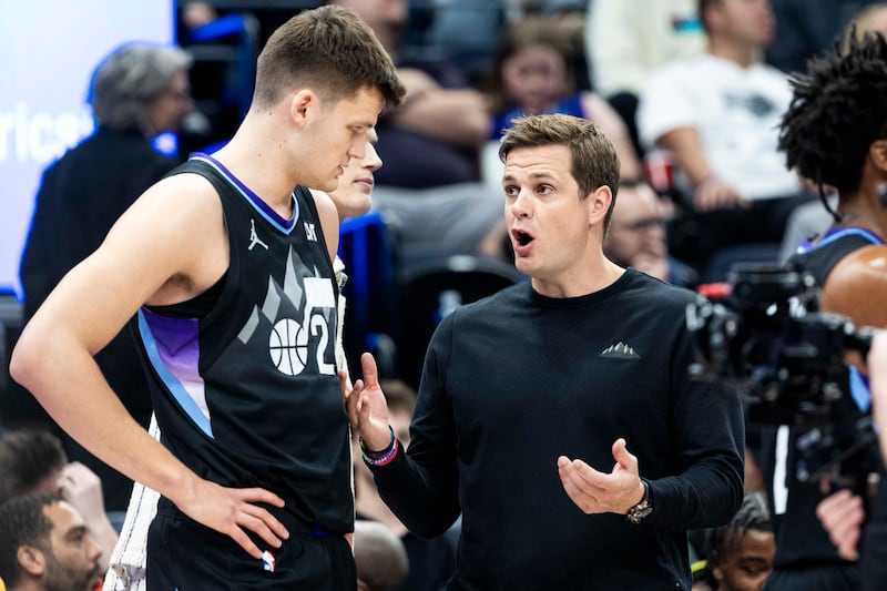 Utah Jazz head coach Will Hardy courtside during a game, leading the team’s next generation