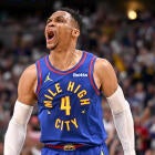 Russell Westbrook driving to the basket in a Nuggets uniform