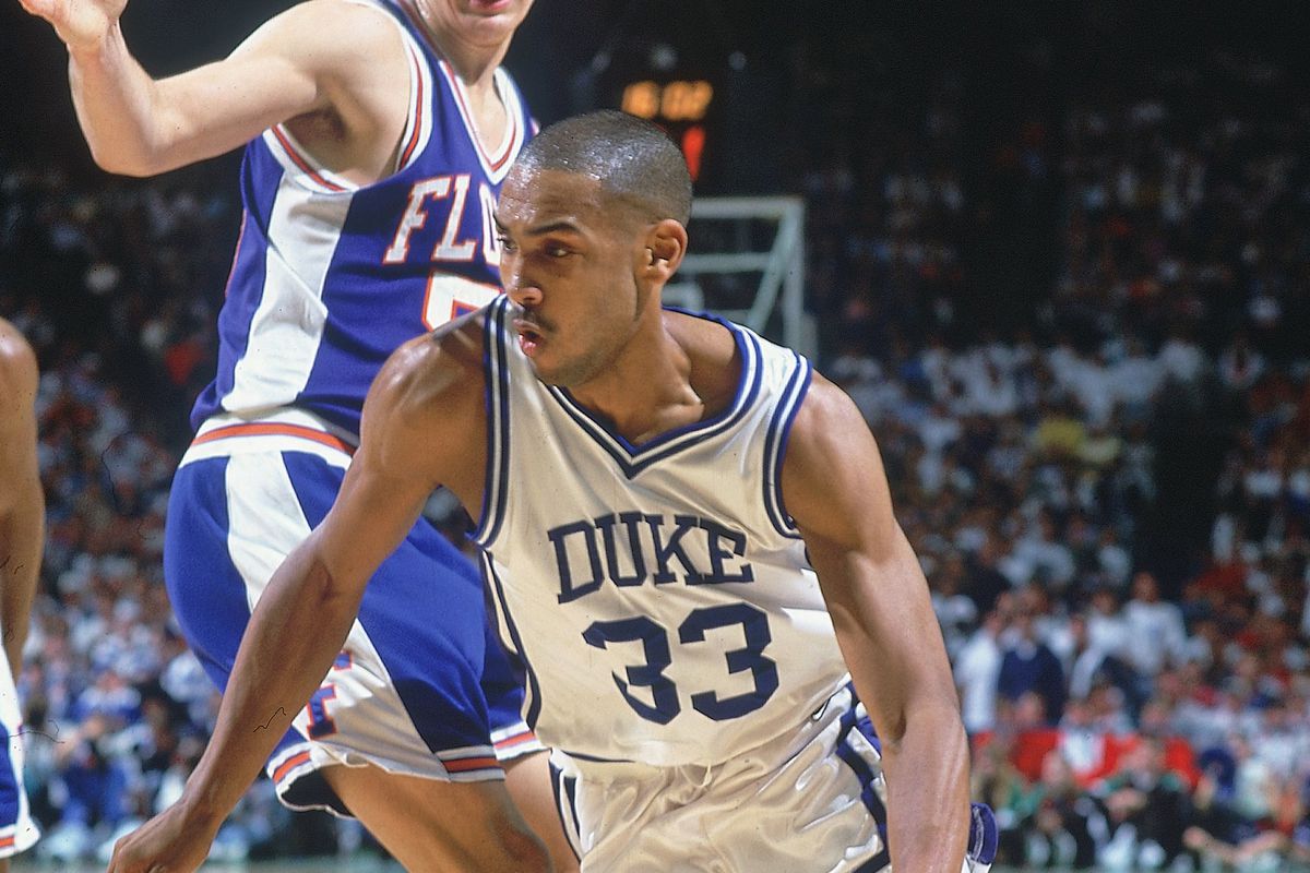 Grant Hill smiling on the court during his NBA career