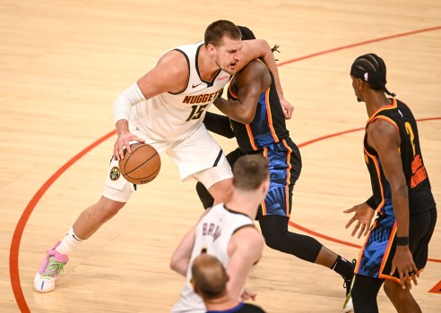 Christian Braun celebrates a key play with teammates in the Nuggets' victory
