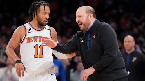 Knicks coach Tom Thibodeau strategizing courtside during a playoff matchup
