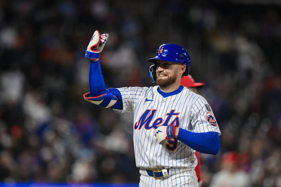 Fans cheering after the latest Mets score at Citi Field