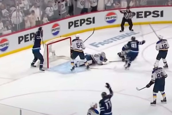 Jets and Blues battling for the puck in tense Game 7 moment