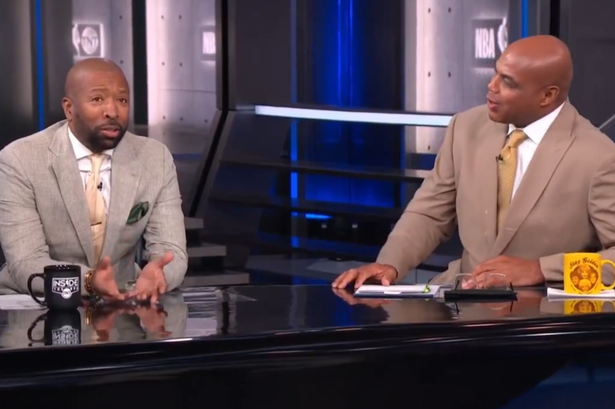 Kenny Smith courtside during broadcasting duties