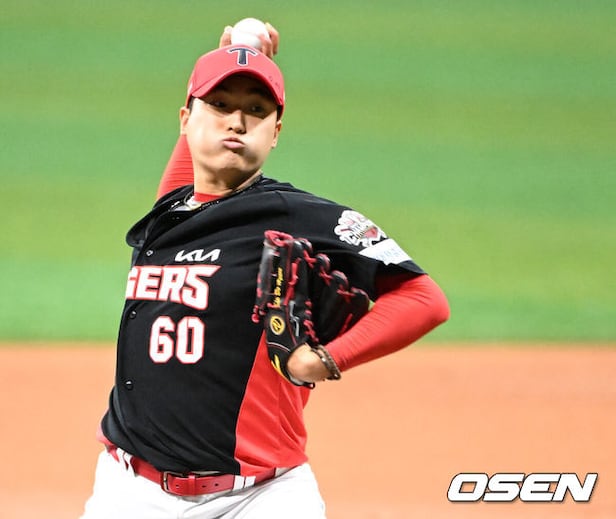 Kia Tigers players celebrate a hard-earned victory