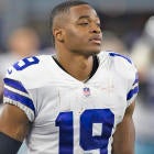 Amari Cooper in action during a game, representing his time with the Dallas Cowboys