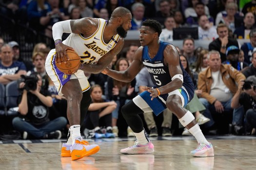 Anthony Edwards in action, highlighting his high scoring and defensive prowess—key aspects of his NBA stats