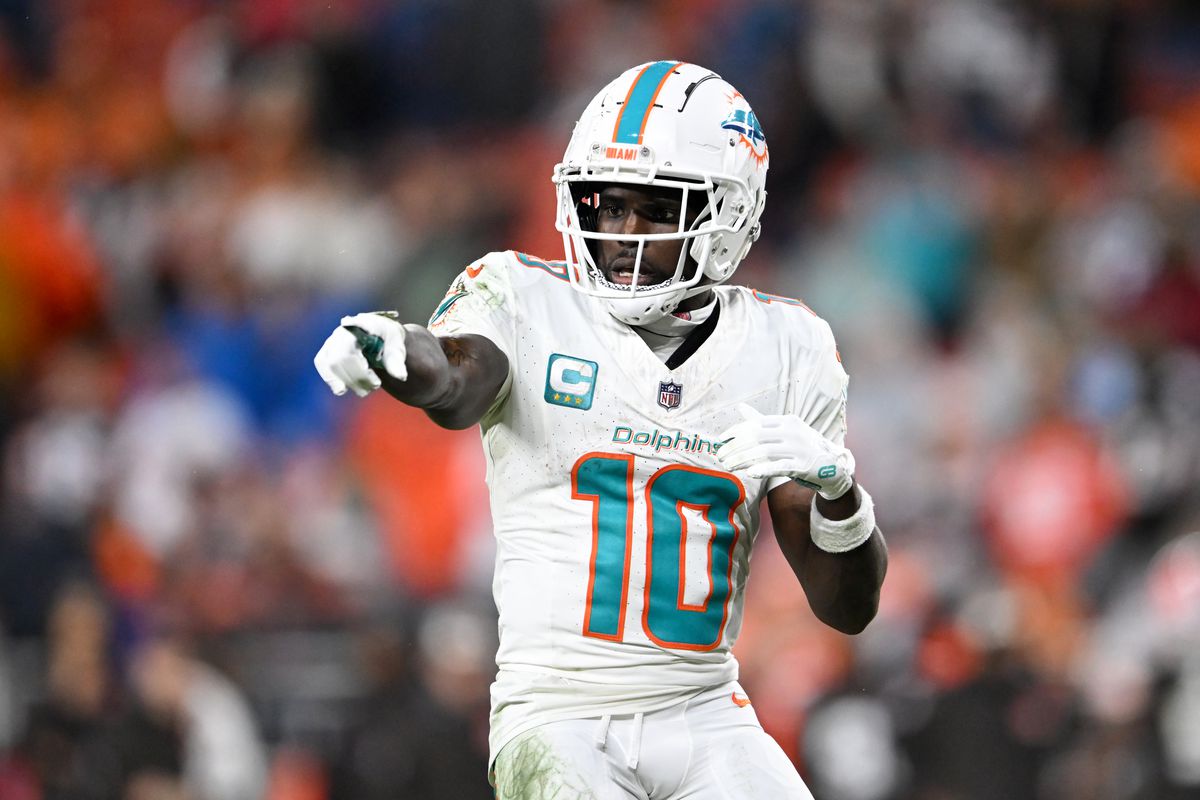 Tyreek Hill warming up on the field for the Miami Dolphins