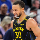 Jonathan Kuminga celebrates on the Warriors bench during the 2025 NBA Playoffs