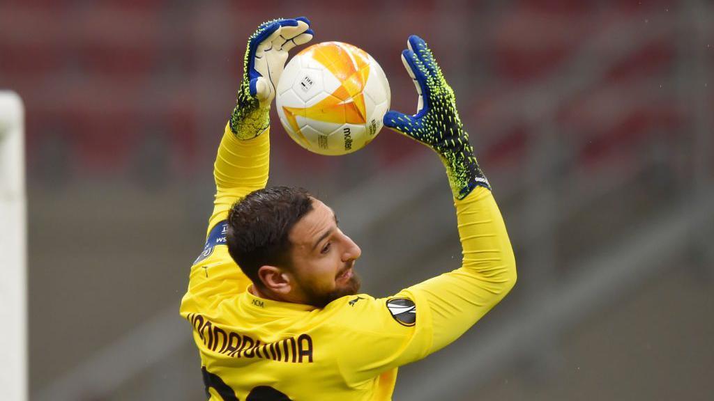 Donnarumma making a crucial save for PSG in Champions League