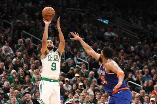Karl-Anthony Towns holding a rebound during Knicks playoff game