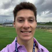 Golfers preparing for the PGA Championship with fans in attendance