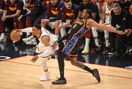 Russell Westbrook dribbling past a defender during the NBA Playoffs.