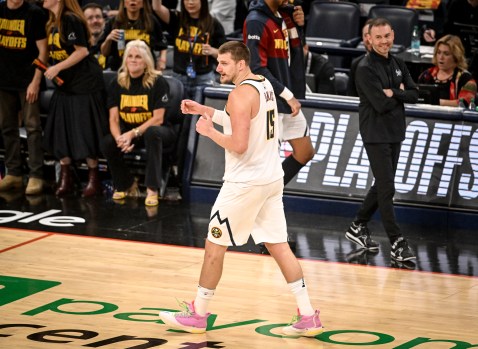 Denver Nuggets coach David Adelman strategizing during a playoff game