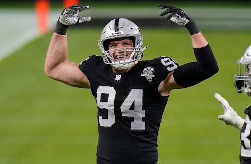 Carl Nassib celebrates during an NFL game, a milestone moment for LGBTQ+ representation