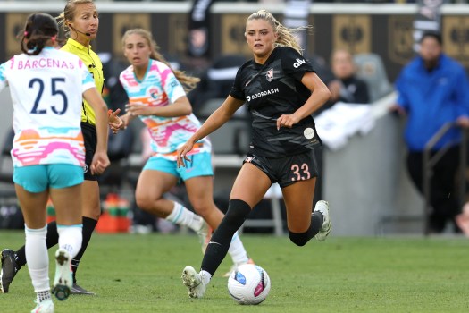 Angel City FC player celebrates a goal during an NWSL match