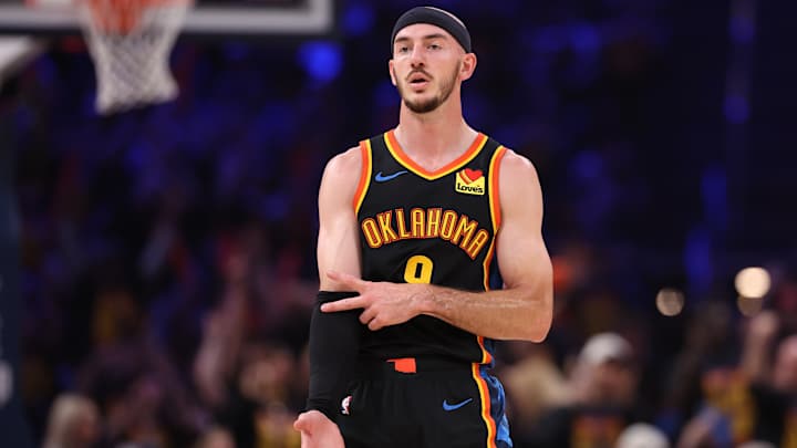 Alex Caruso diving for a loose ball in an Oklahoma City Thunder game