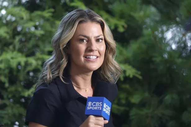 Amanda Balionis smiling on location at a golf event