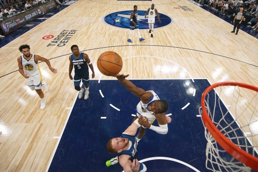 Jonathan Kuminga battles for a rebound during the NBA playoffs