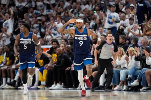 Nickeil Alexander-Walker celebrates a critical three-pointer during the NBA playoffs with the Timberwolves.