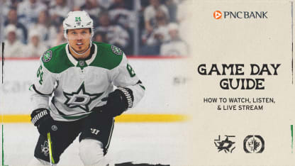 Stars vs Jets playoff matchup, players battling for the puck near the boards