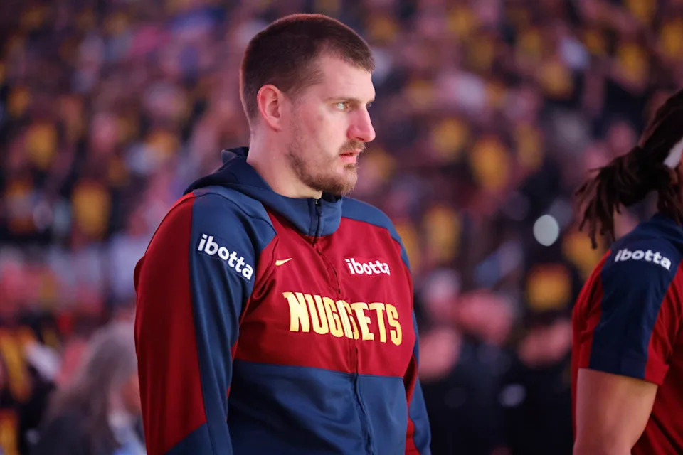 Nikola Jokic arrives at Ball Arena in a Joker-inspired suit, highlighting his personality off the court.