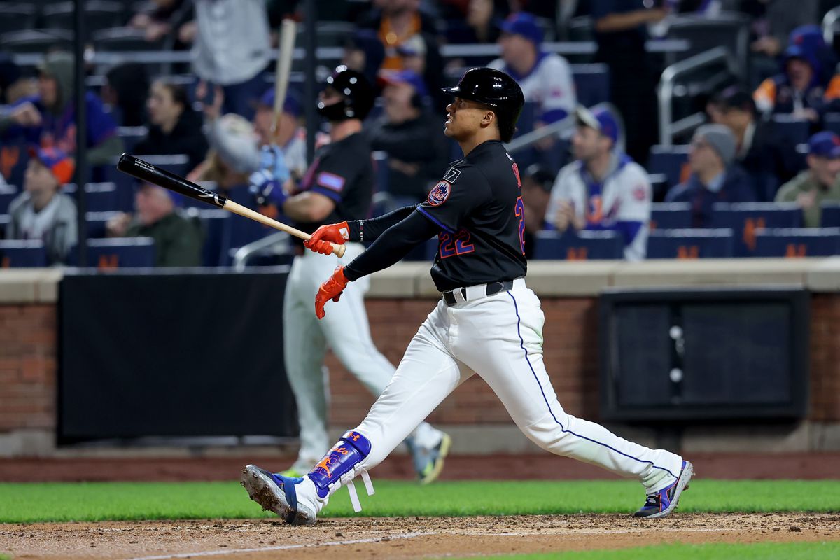 Mets players celebrating a win against the Cubs at Citi Field