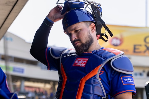 Luis Torrens in action behind the plate, showing determination during a recent Mets game