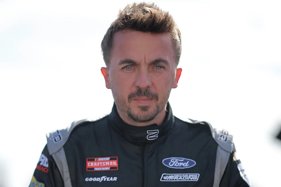Frankie Muniz focused at a NASCAR race, channeling the same dedication he once brought to acting.