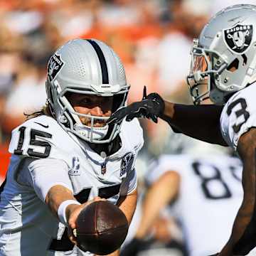Josh Jacobs runs the ball for the Raiders