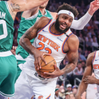 Anthony Edwards drives past a Warriors defender in the NBA Playoffs.