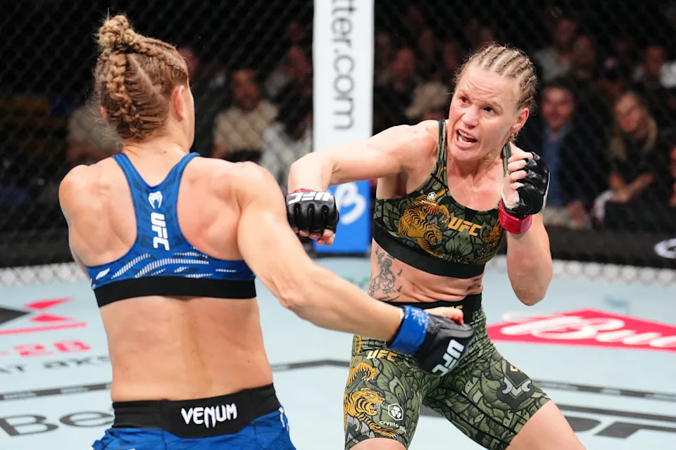 Zhang Weili celebrating a UFC victory, showcasing her championship spirit