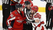 Carolina Hurricanes players celebrate a pivotal play during Game 3 against the Capitals