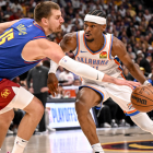 Jamal Murray drives against the Thunder defense in a tense playoff moment - thunder - nuggets series
