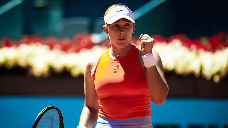 Emma Navarro at a professional tennis tournament, focused during match play
