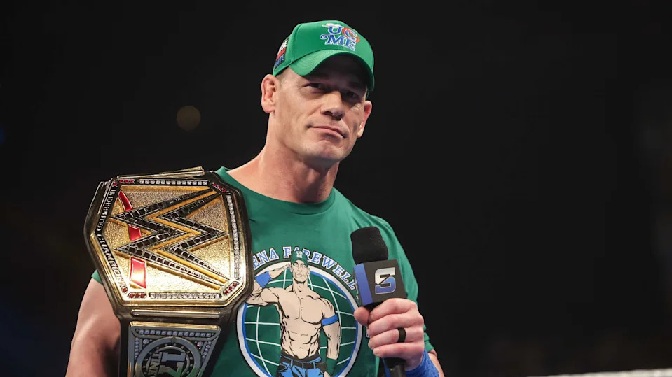 John Cena at WWE Backlash 2025, celebrating victory with the championship belt