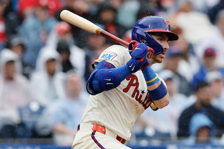Bryson Stott prepares in the on-deck circle before his leadoff at-bat for the Phillies