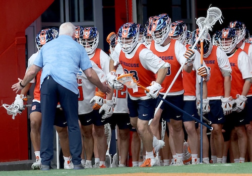 Players celebrate after Syracuse lacrosse's comeback victory over Harvard in the NCAA tournament