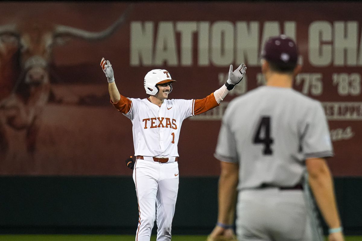 A tense moment during a top-25 NCAA baseball matchup, reflecting shifts in college baseball rankings