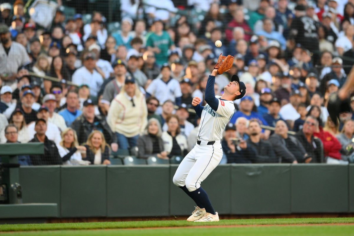 Seattle Mariners game action: fans and players caught in a tense moment during the latest Mariners game