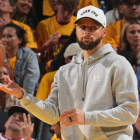 Steph Curry on the bench during injury recovery