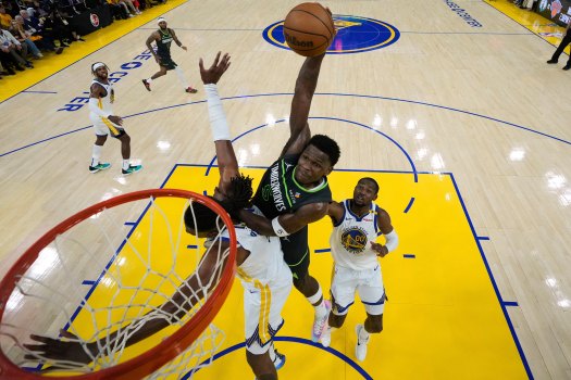 Nickeil Alexander-Walker driving to the basket during a Timberwolves playoff game